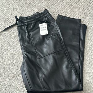 Blank NYC size 26 NWT black faux leather straight legged. Ankle length